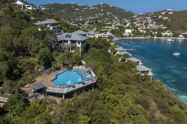 aerial view of point pleasant pool overlooking cliffside and blue water bay