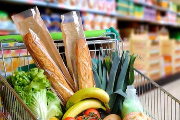 image of a full shopping cart at a grocery store