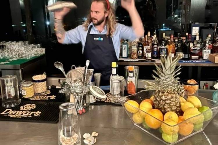 bartender at Ocean 180 shaking cocktails