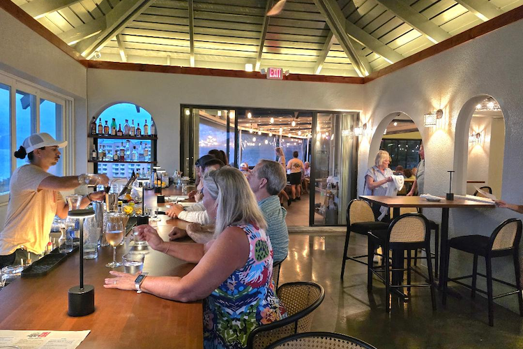 guests at the lionfish restaurant bar