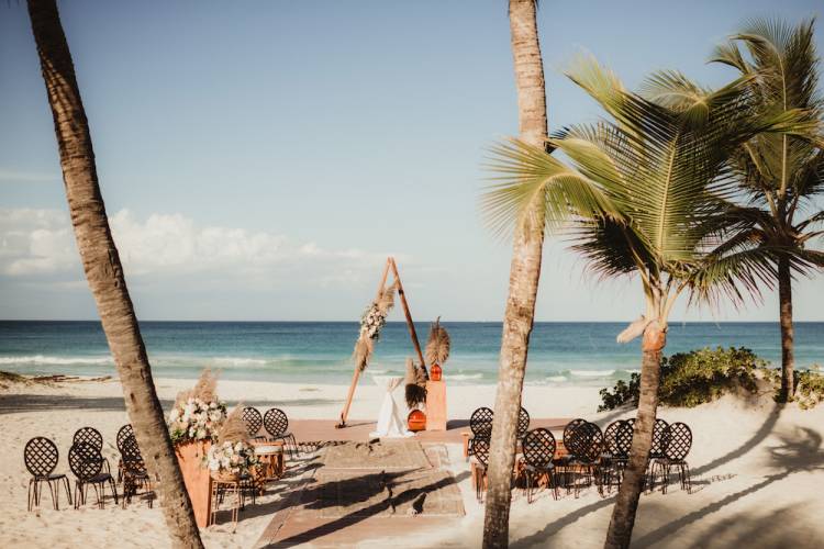 destination wedding set-up on beach with palm trees